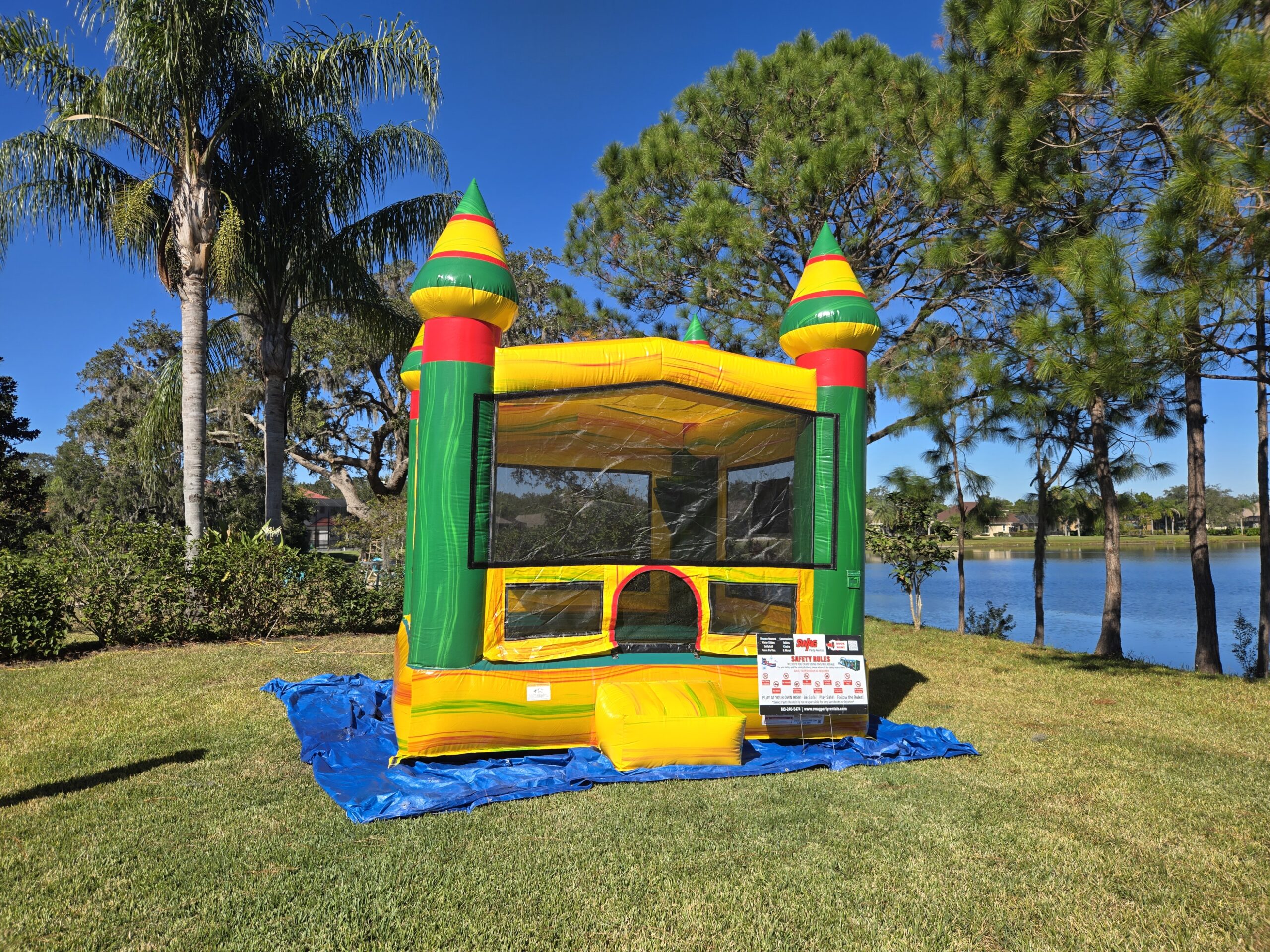 backyard birthday party setup in Lutz Florida with bounce house and kids playing