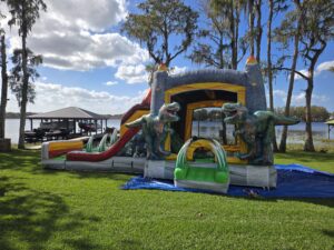 Dinosaur themed Lava Raptor bounce house and slide combo rental in Odessa Florida