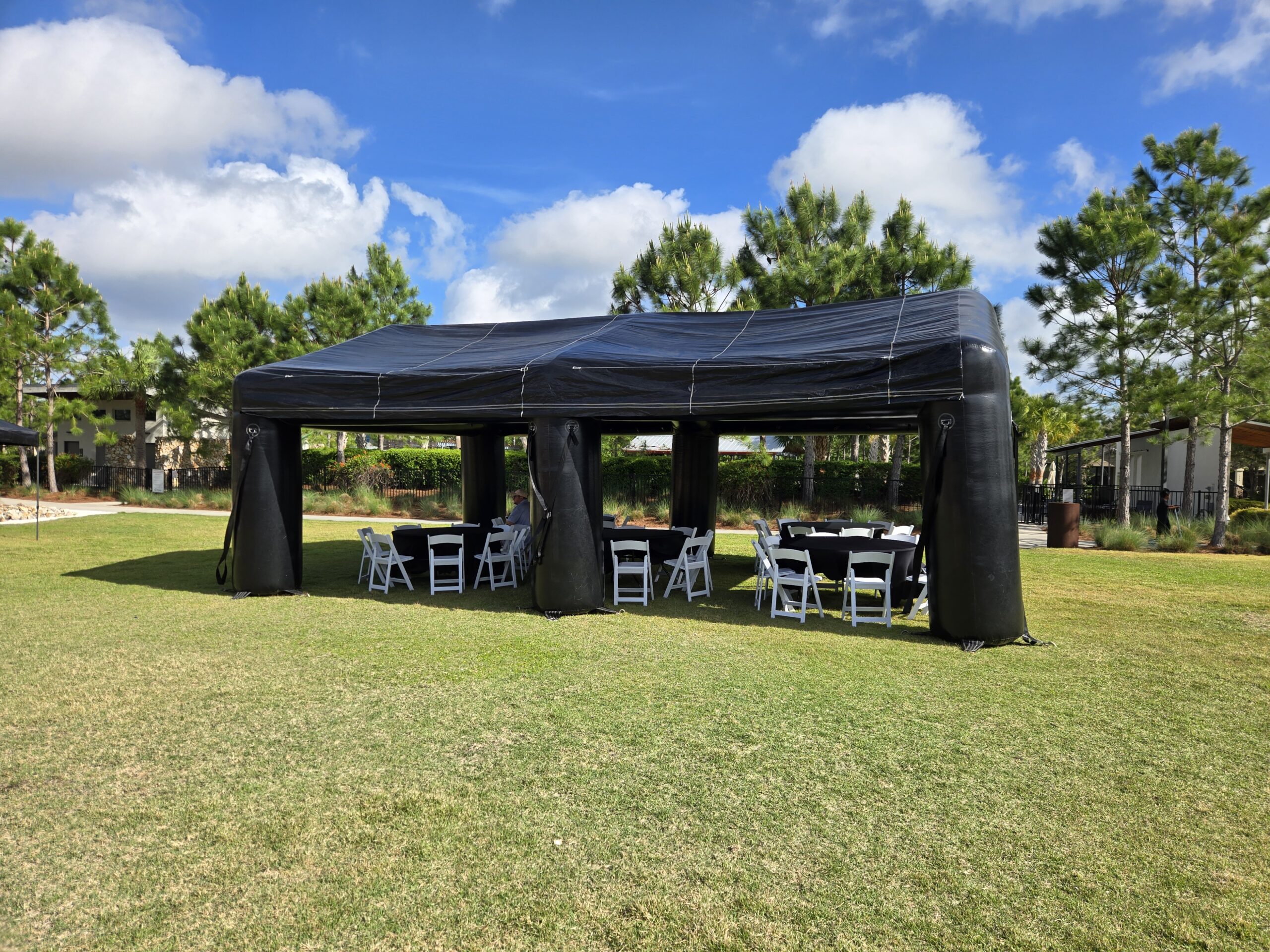 table and chair rental setup in Odessa Florida backyard party with tent and decorations