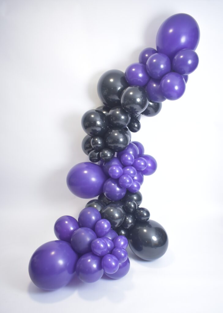 Balloon garland in Odessa FL used as a backdrop for birthday and graduation party setup