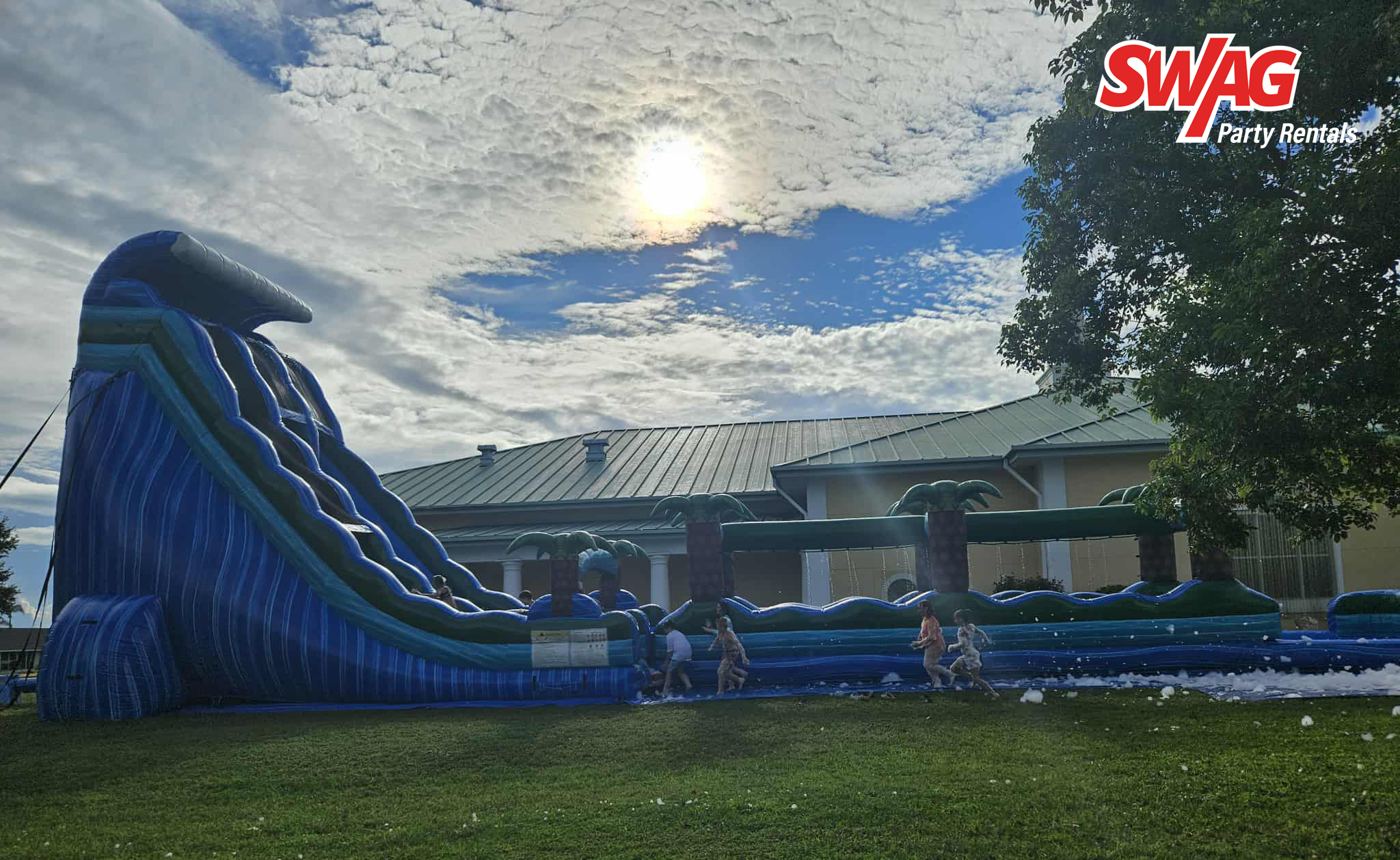church event rental setup in New Port Richey Florida with inflatables tables and chairs