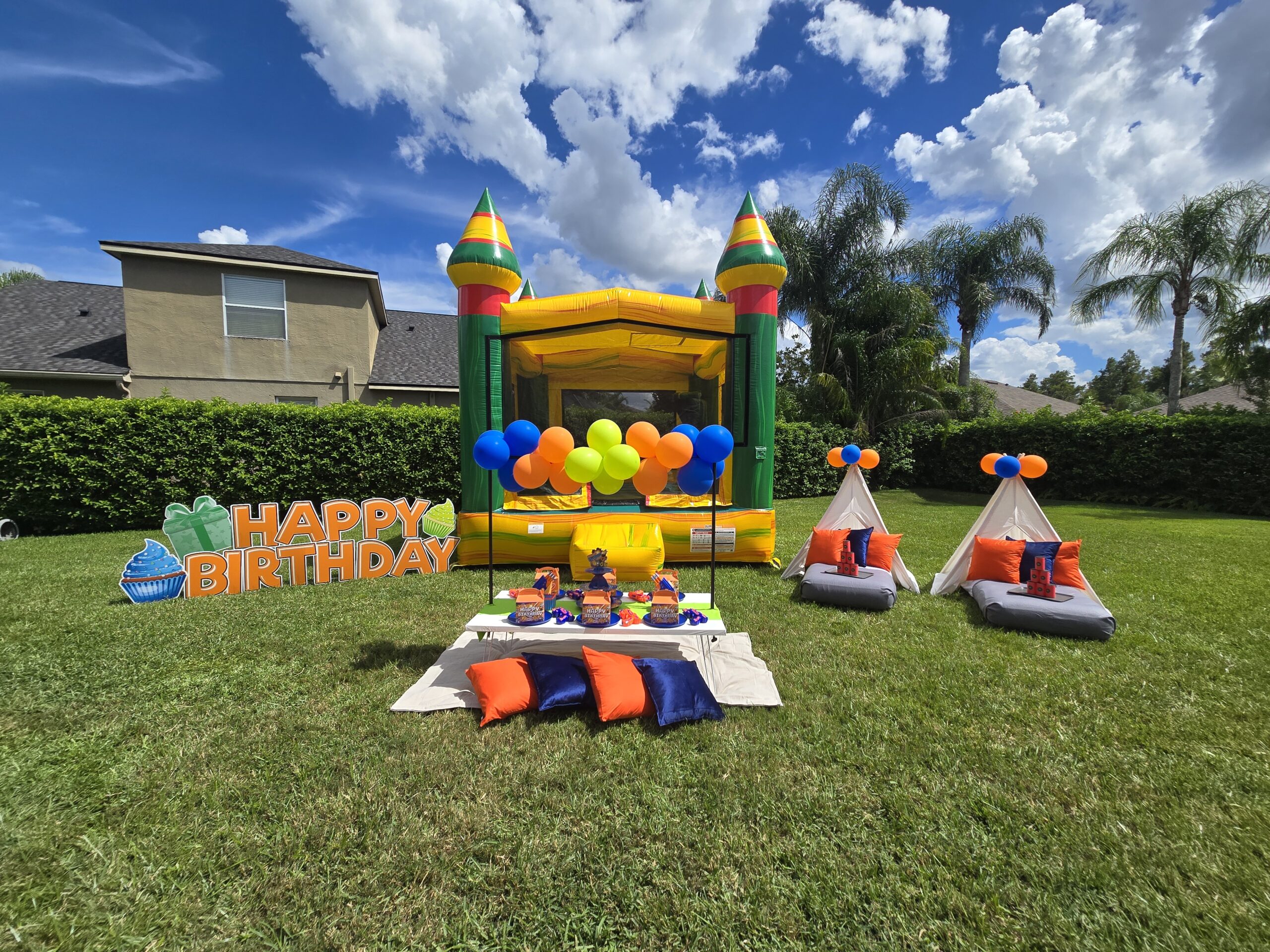 Nerf themed birthday party setup in Lutz FL with bounce house balloons and yard display